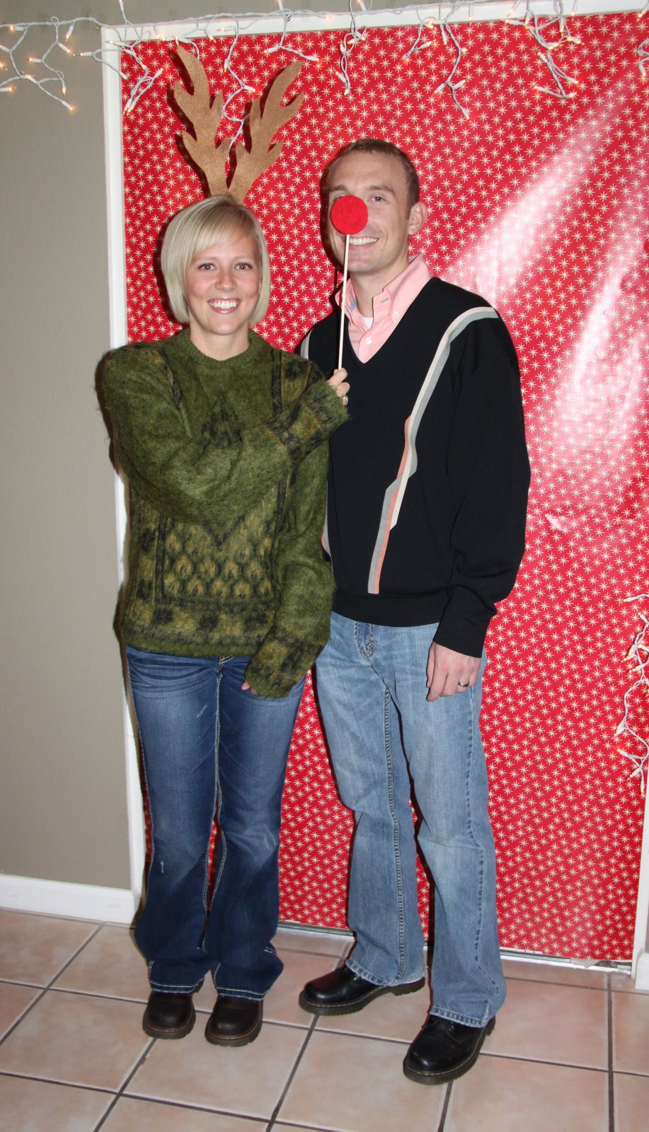 Couple christmas sweater party. 