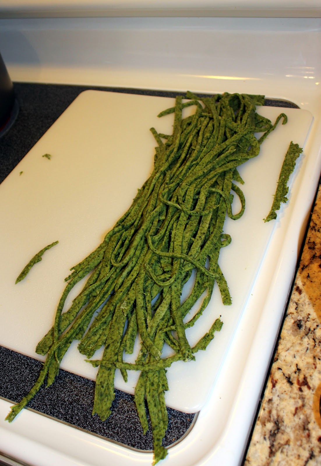 Spinach noodles cut into strips. 