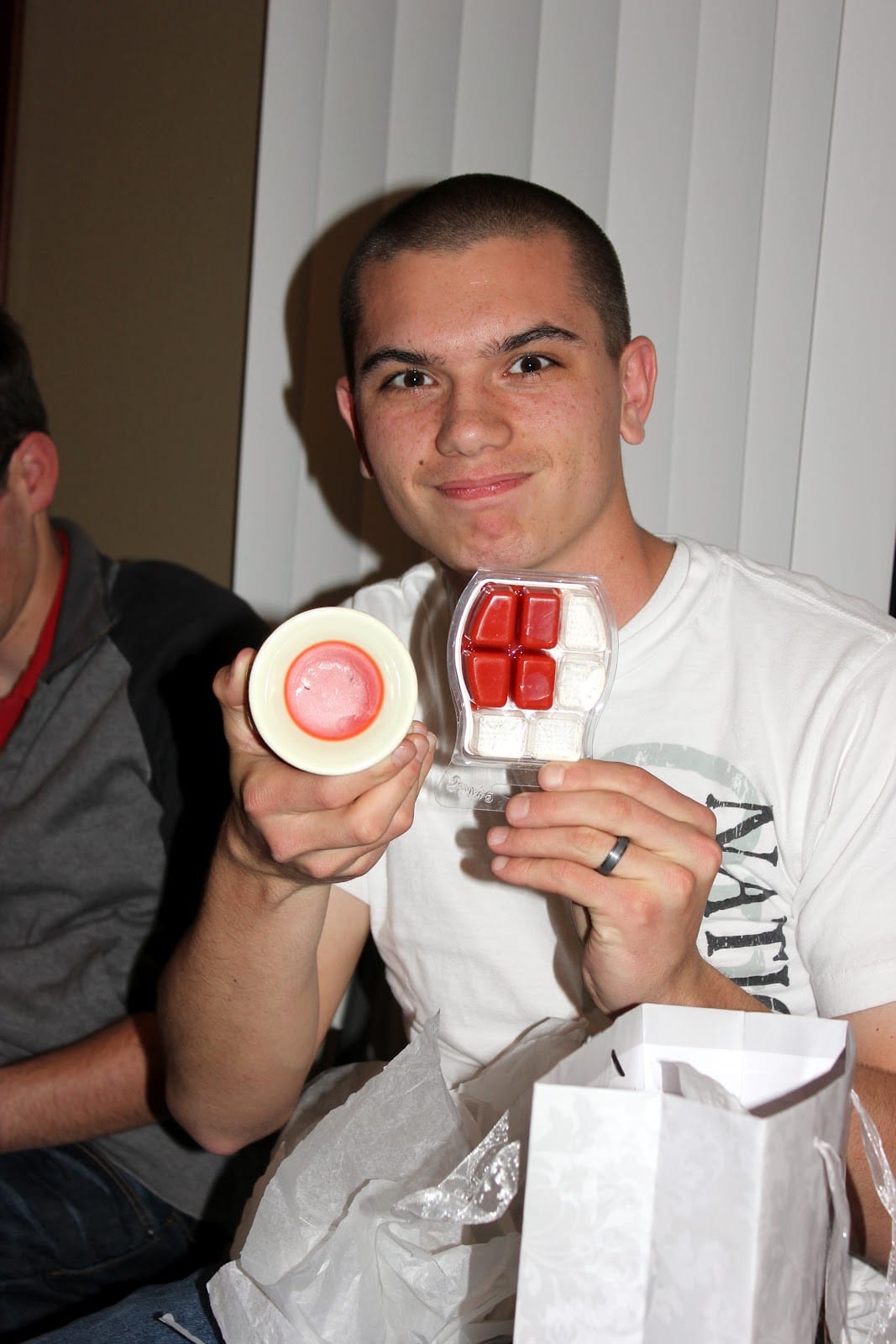 Man holding a pre used gift given as a wedding present. 