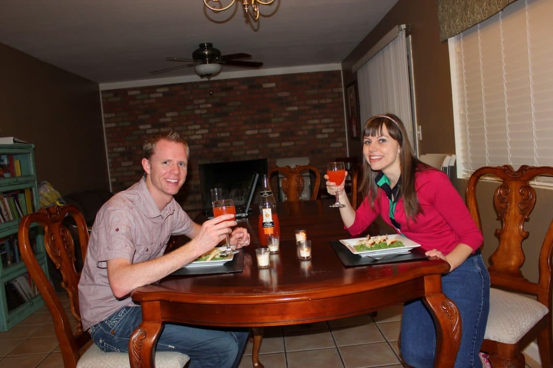 Couple enjoying a dinner date night at home. 