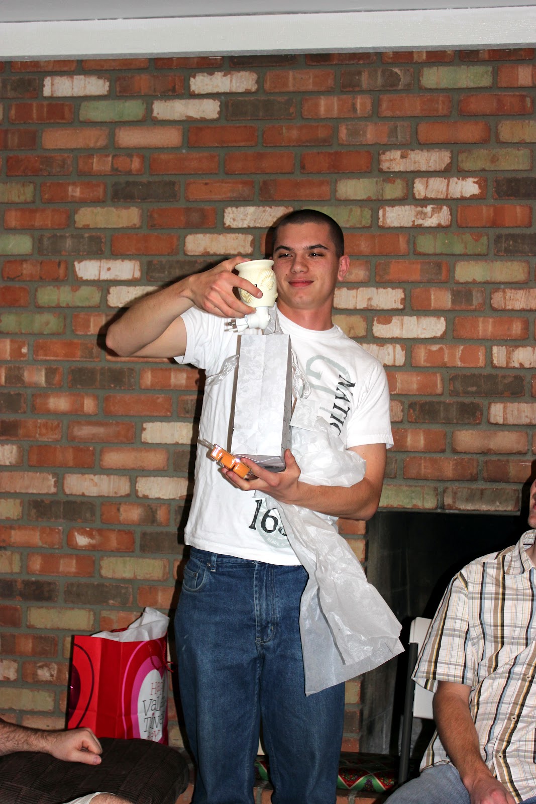 A man showing the worst wedding present he received. 