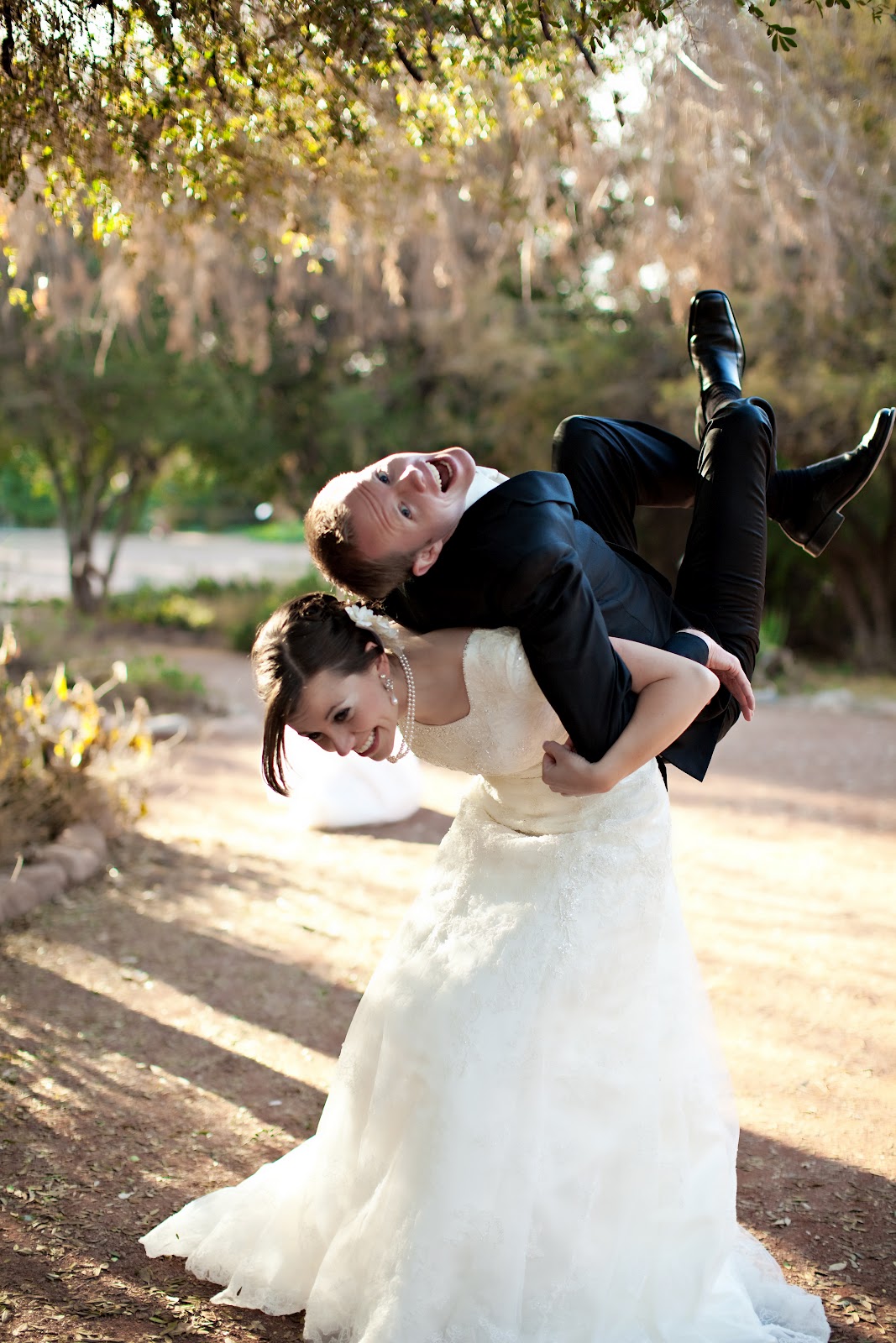 Fun wedding photo idea with the husband on the wife\'s back. 