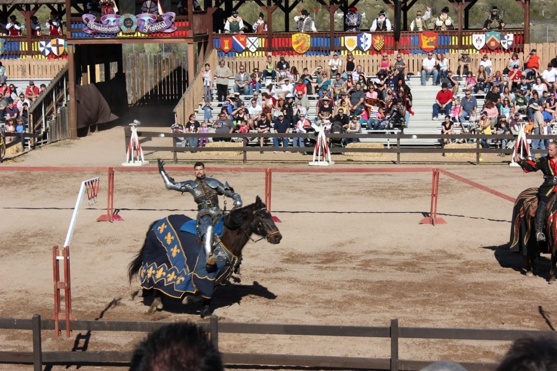 Arizona Renaissance Festival jousting match knight riding by the crowd.