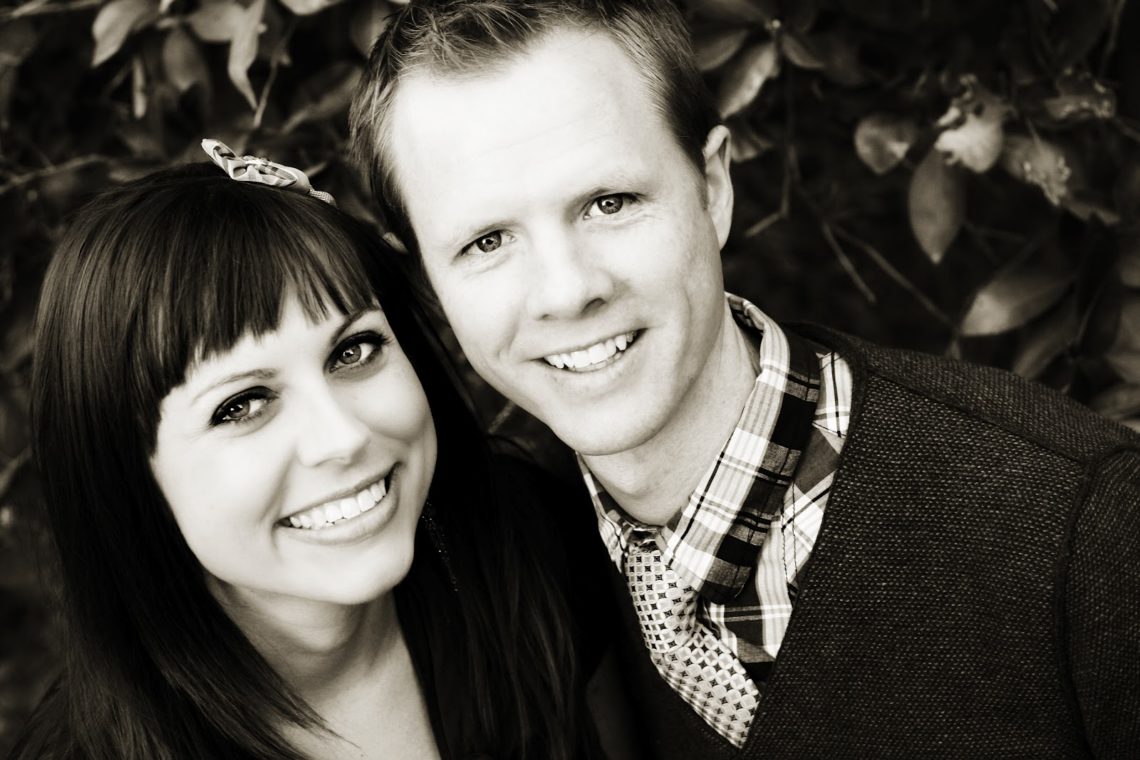 Married couple taking first wedding anniversary pictures. 