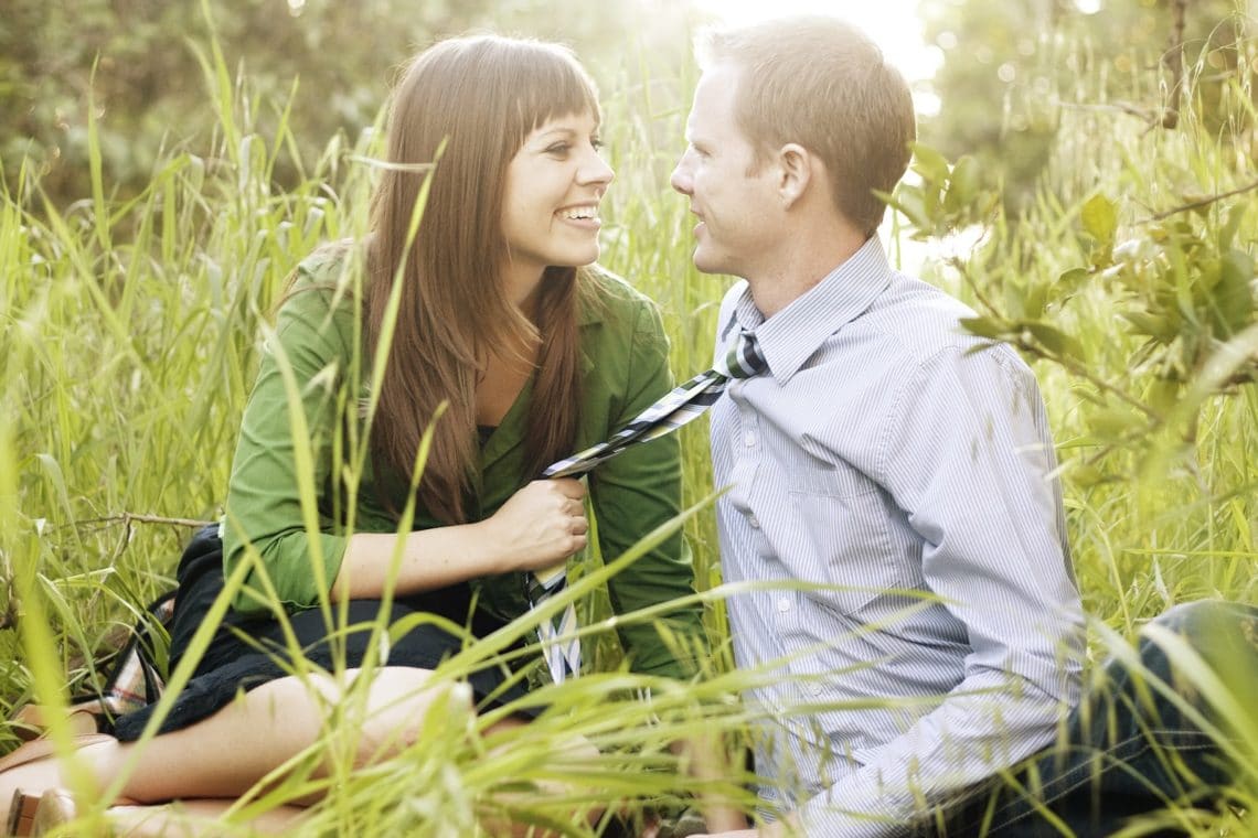 First wedding anniversary photo shoot in a grassing field. 