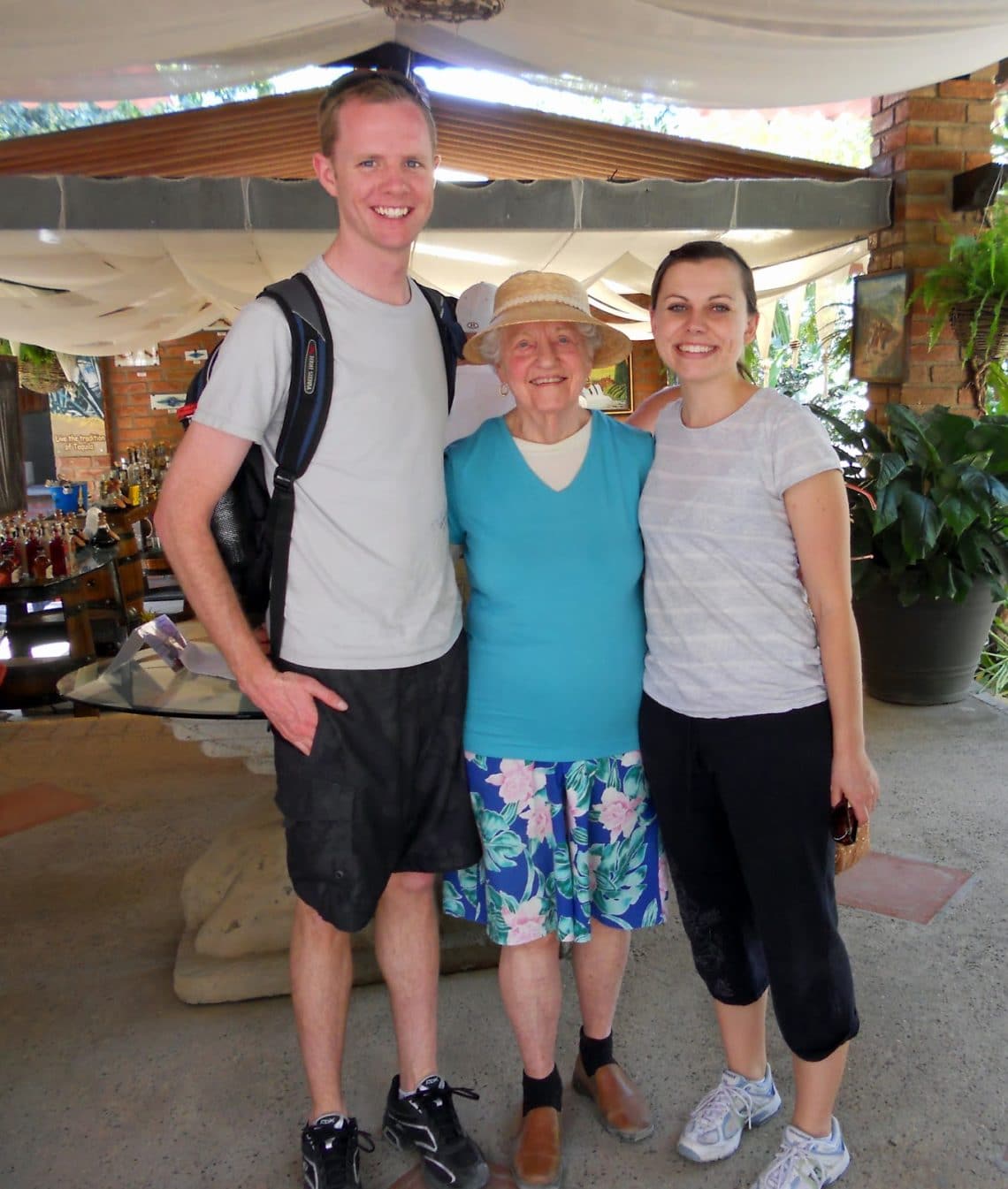 A young couple going ziplining with a 91 year old woman. 