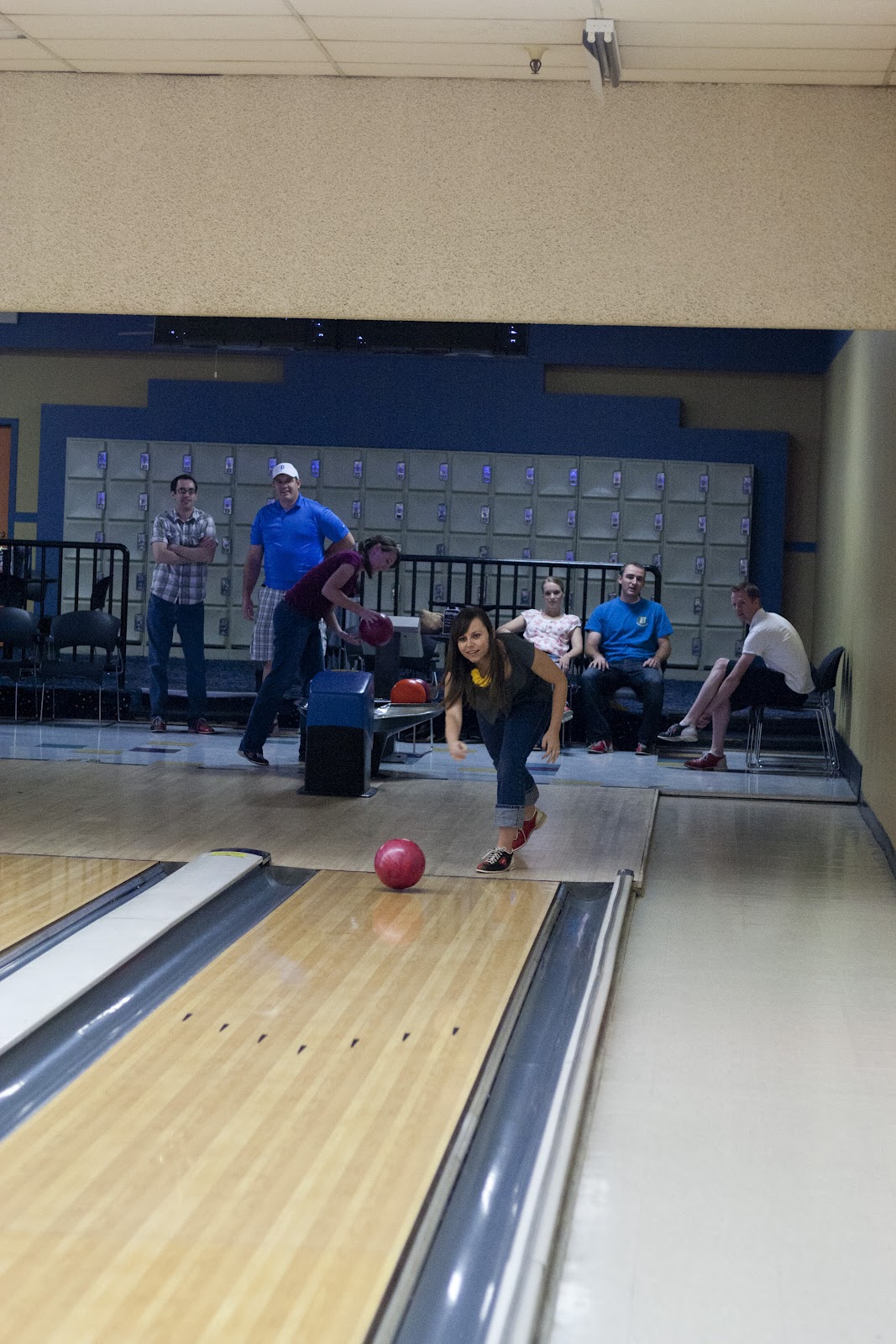 A woman demonstarting how to play a Bowling with a twist game. 