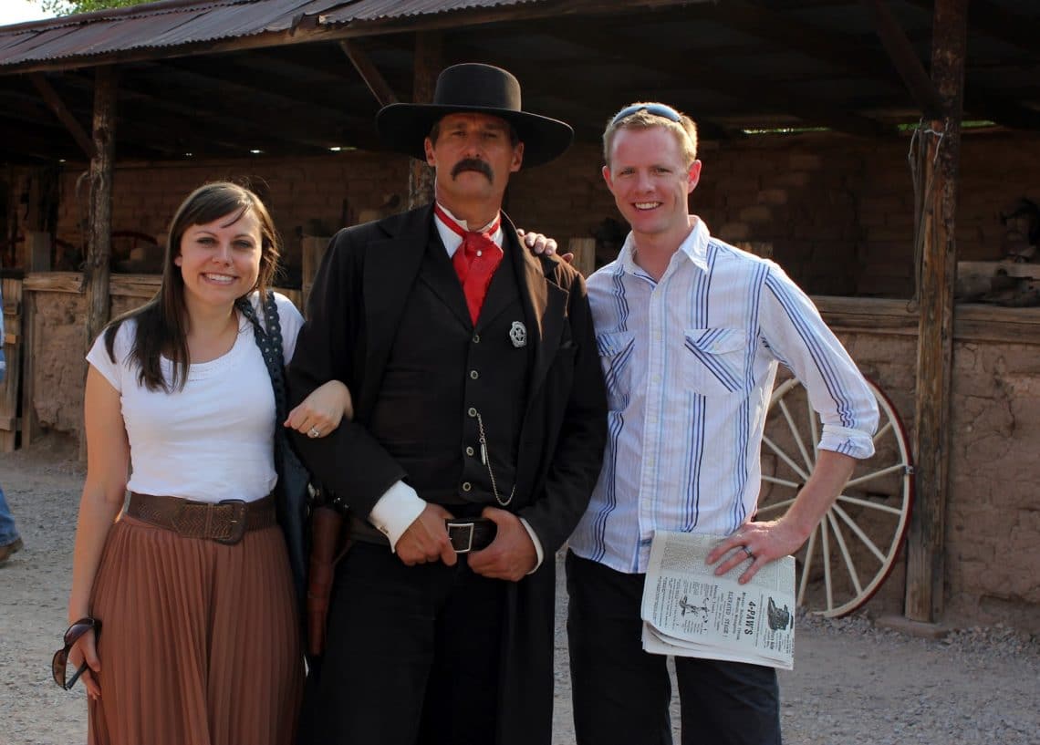A couple standing with the sheriff at the gun show at the O.K. Corral in Tombstone Arizona. 