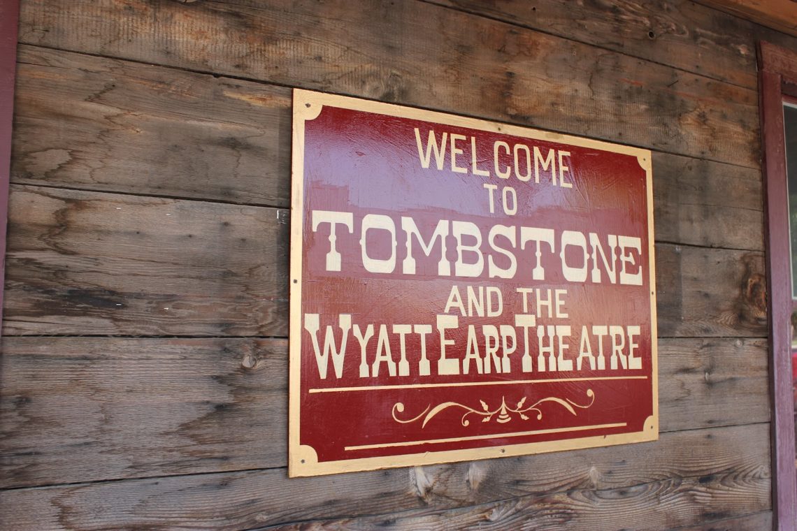 Tombstone Arizona tourism sign: Welcome to Tomstone and hte Wyatt Earp Theatre. 