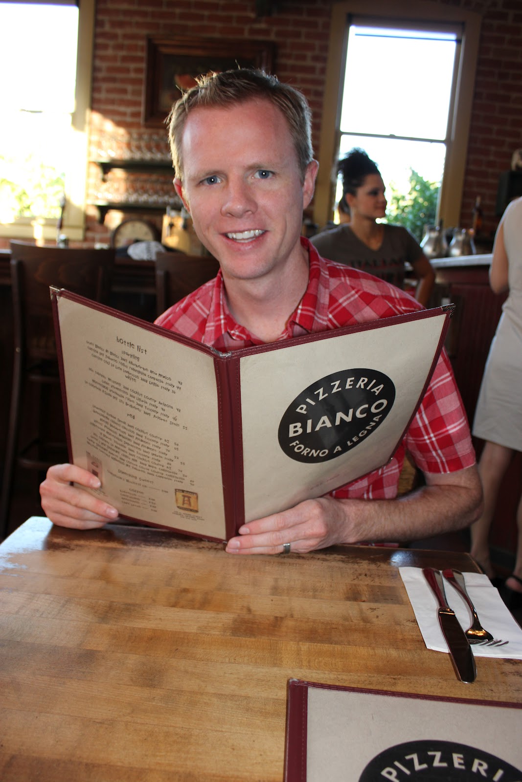 Man holding the menu at a Pizzeria Bianco Date Night. 