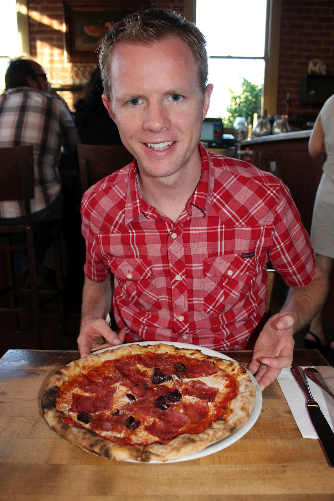 A man about to enjoy a pizza on Pizzeria Bianco Date Night. 