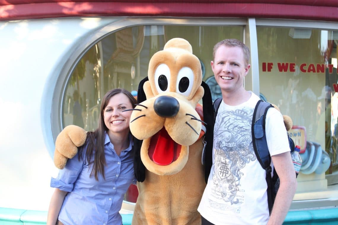 Disneyland date: couple with Pluto. 