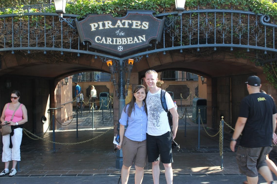 Disneyland date for couples: couple in front of Pirates of the Carribean ride. 