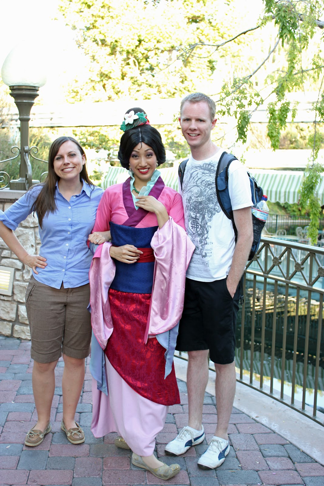 Disneyland date: couple in front of Disneyland castle. 