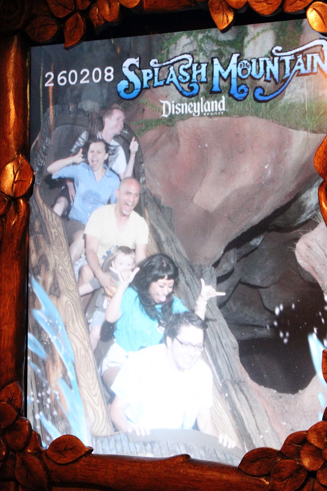 Disneyland date for couples: couple riding Splash Mountain. 