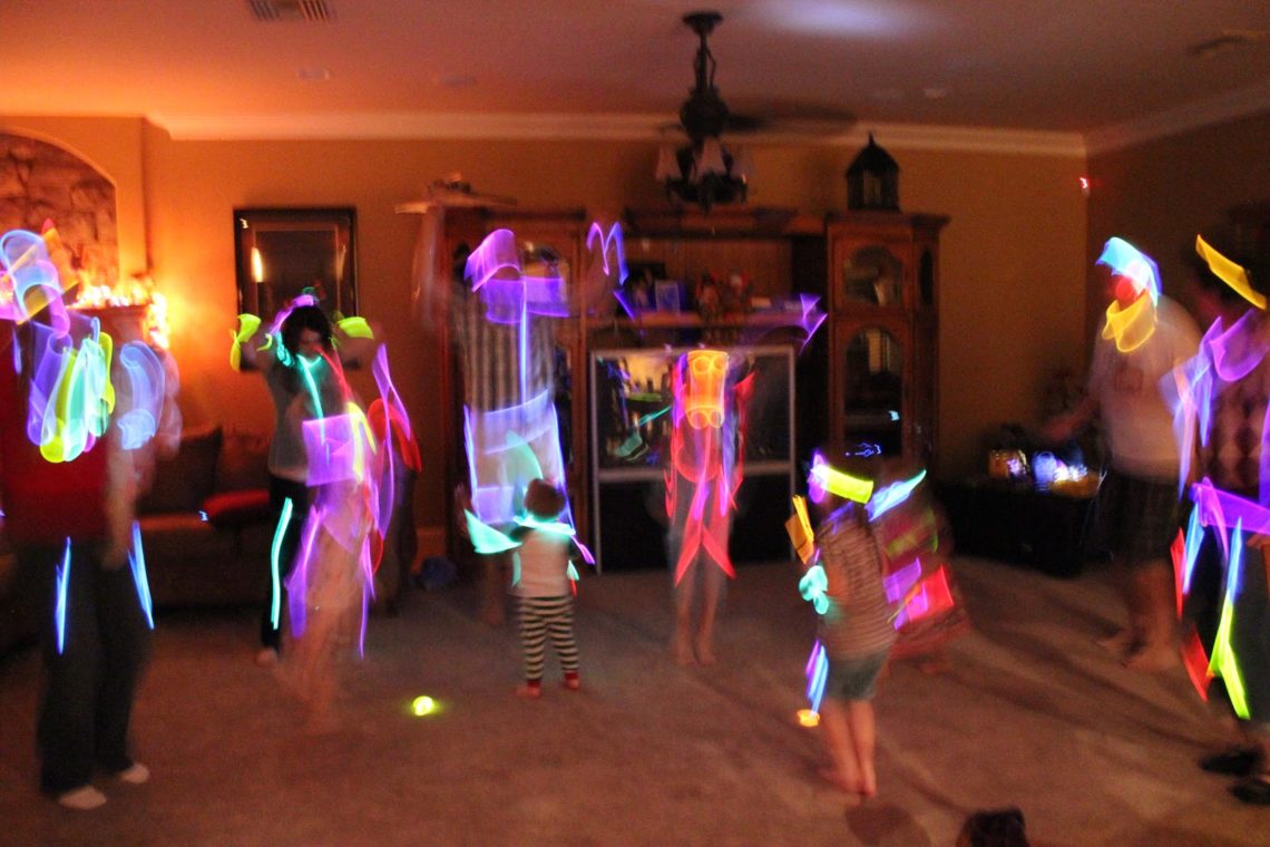 Neon dance party with glowsticks. 