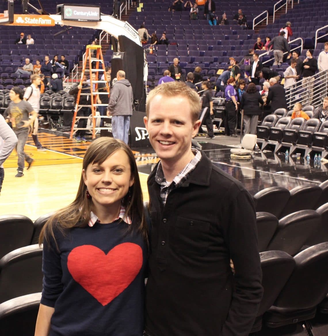 Couple on a date to a Sun's game. 