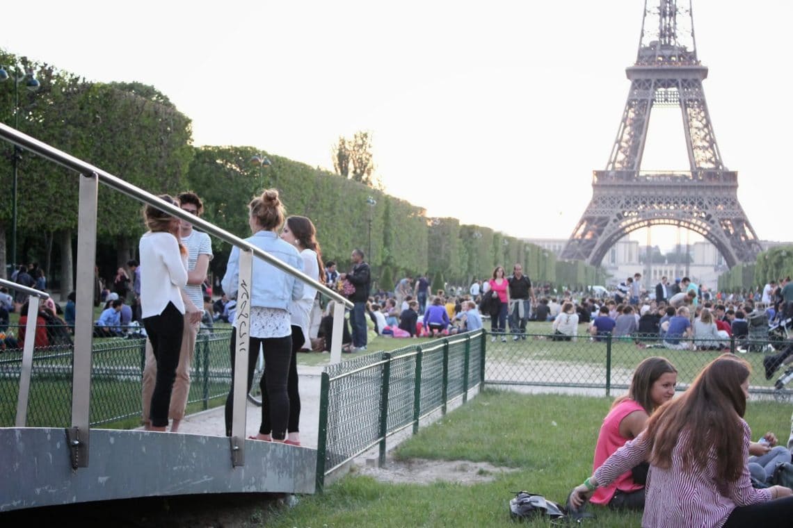 People watching outside the The Eiffel Tower. 