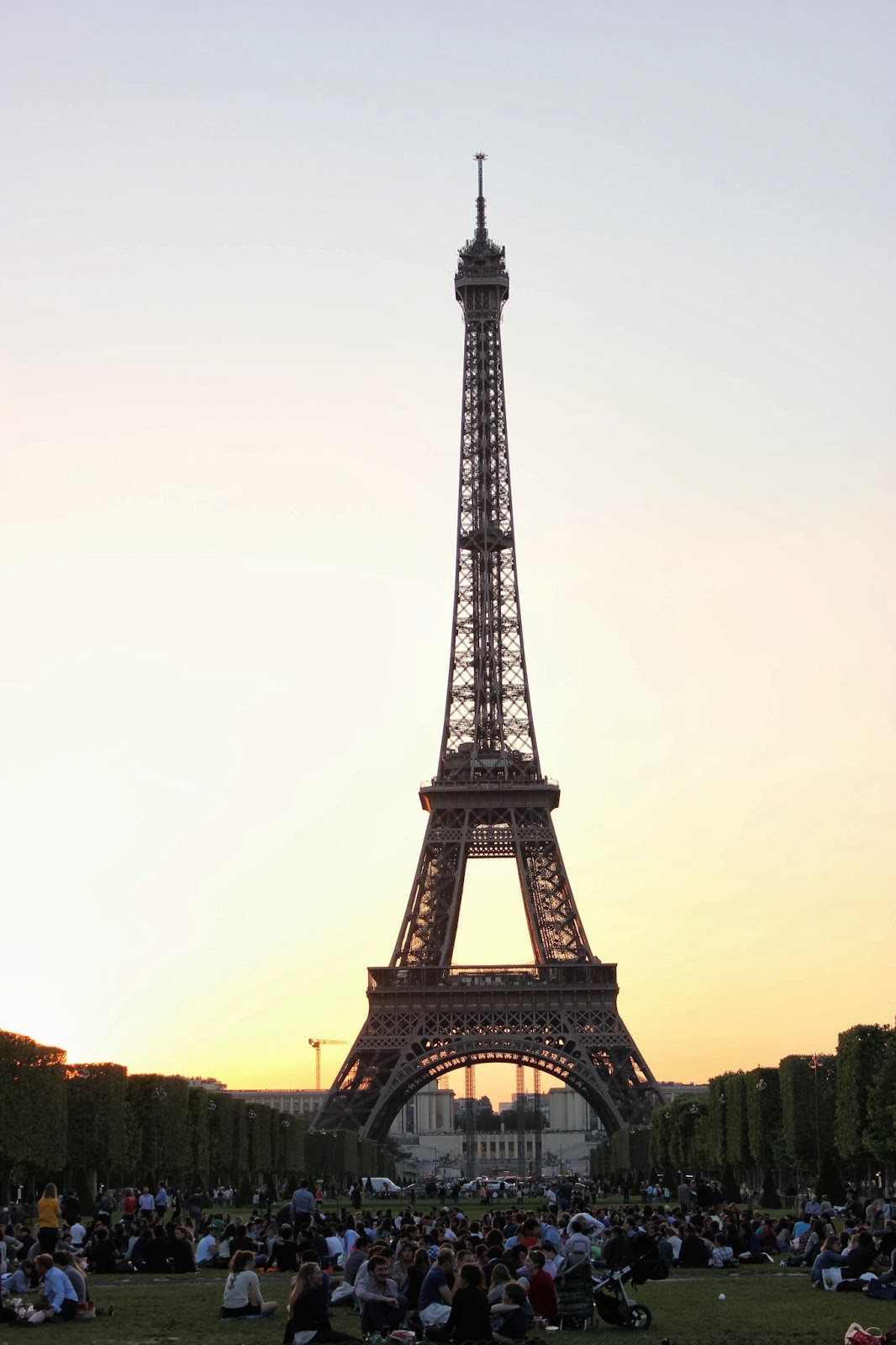 The sun setting behind the The Eiffel Tower. 