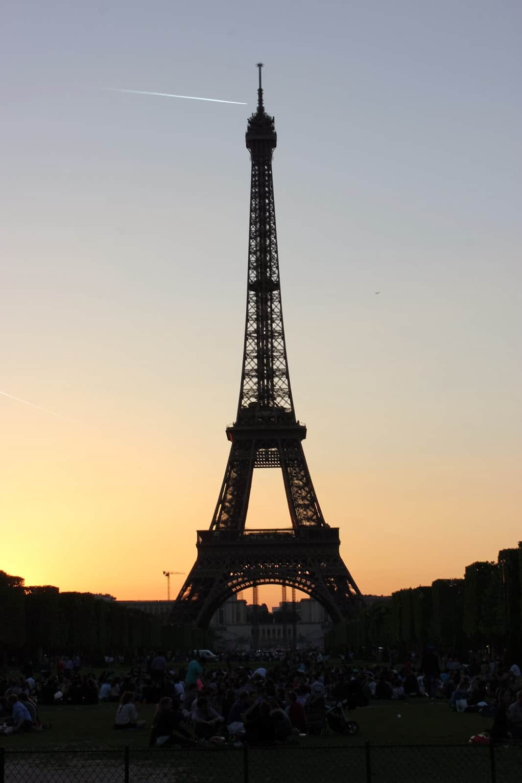The sun setting behind the The Eiffel Tower. 
