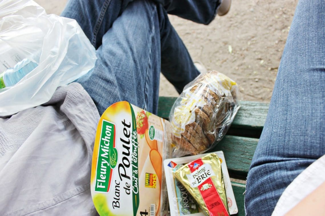 A picnic in Paris: picnic food on a bench. 