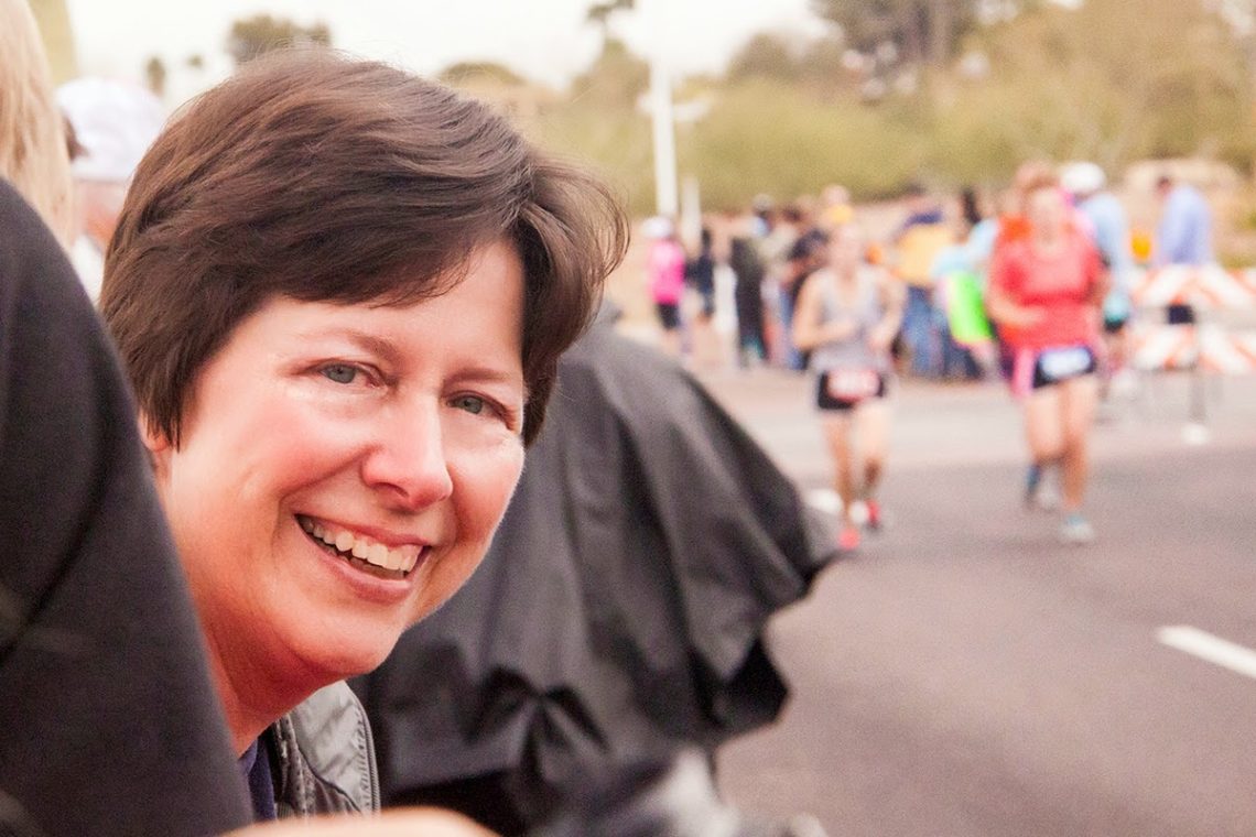 Mom cheering on her kid during a marathon. 