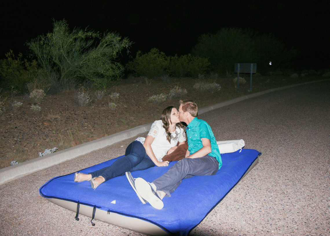 Couple kissing under the stars at night. 