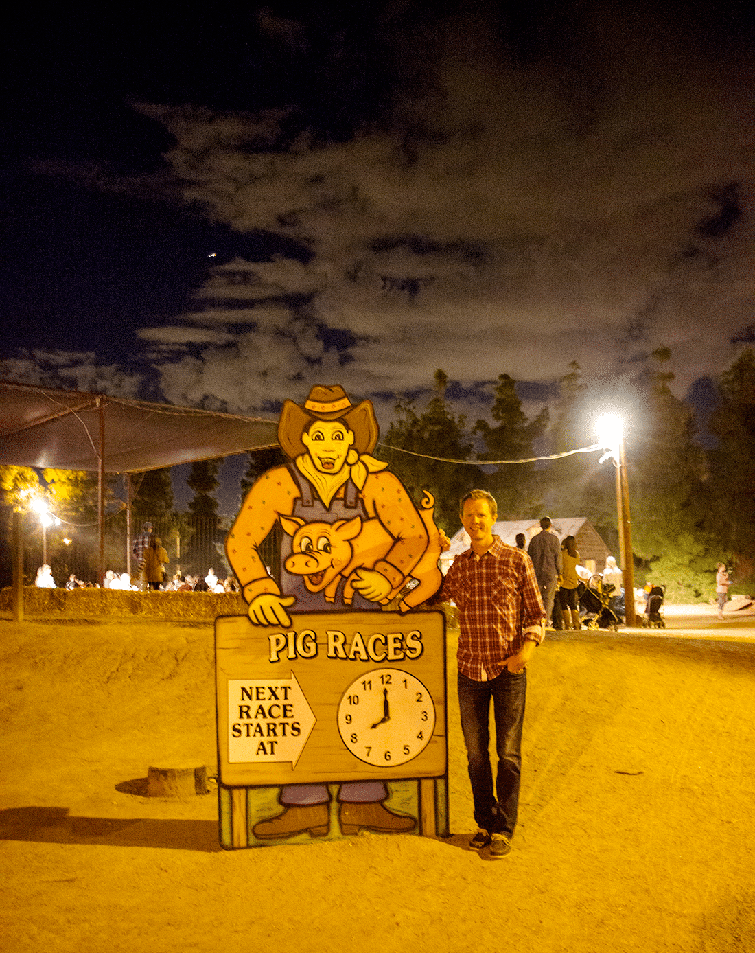 Pig Calls sign at Schnepf Farms Pumpkin and Chili Fest at nighttime. 