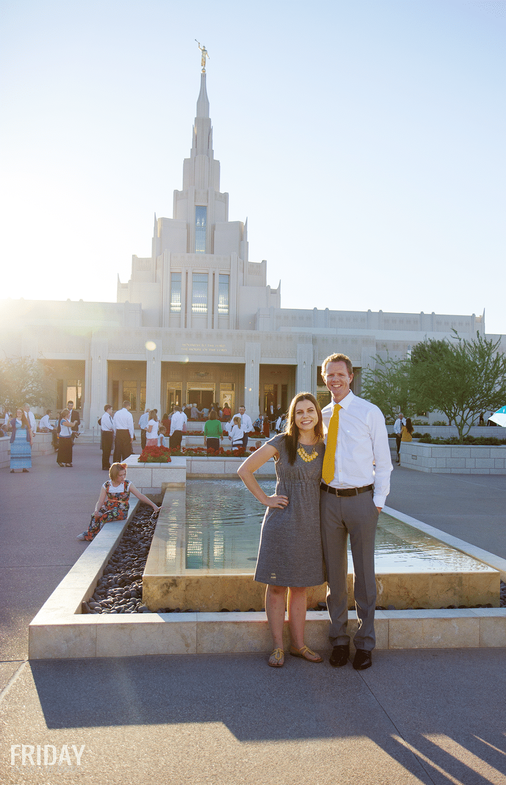 A couple standing in front of the Phoenix LDS Temple. 