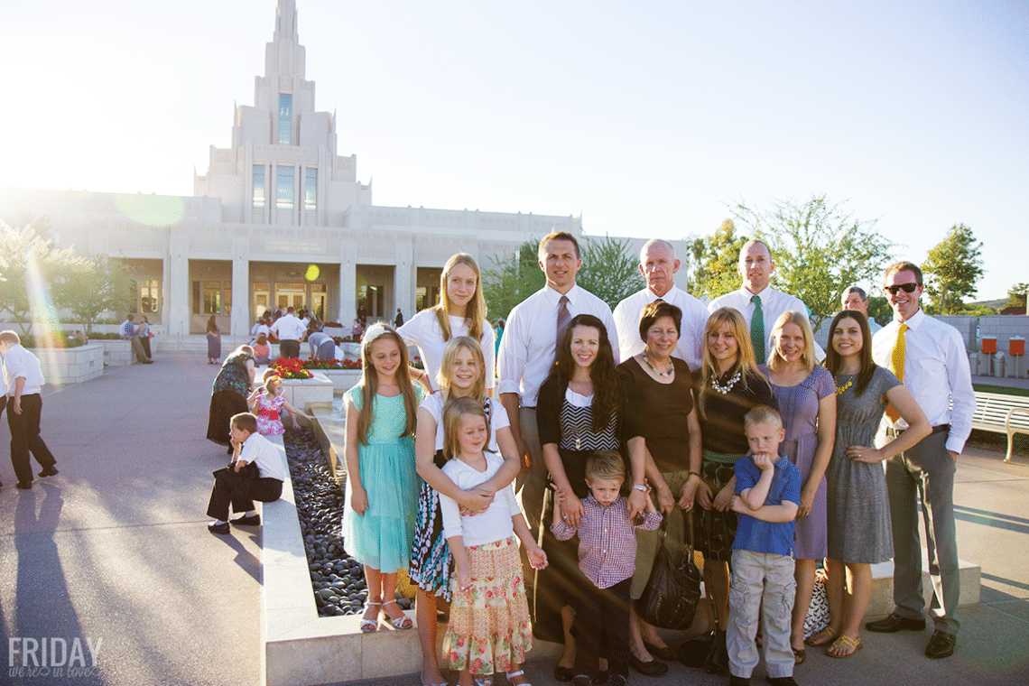 A family standing in front of the Phoenix temple. 