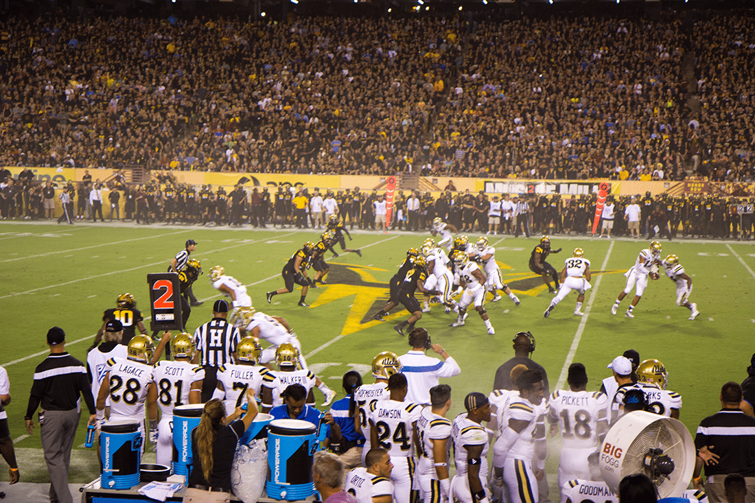 ASU team during a play on a College Football Game Date