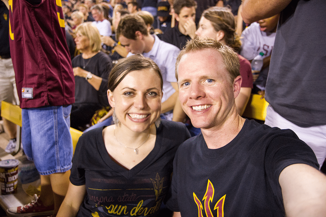 A couple in ASU shirts ready to enjoy a College Football Game Date