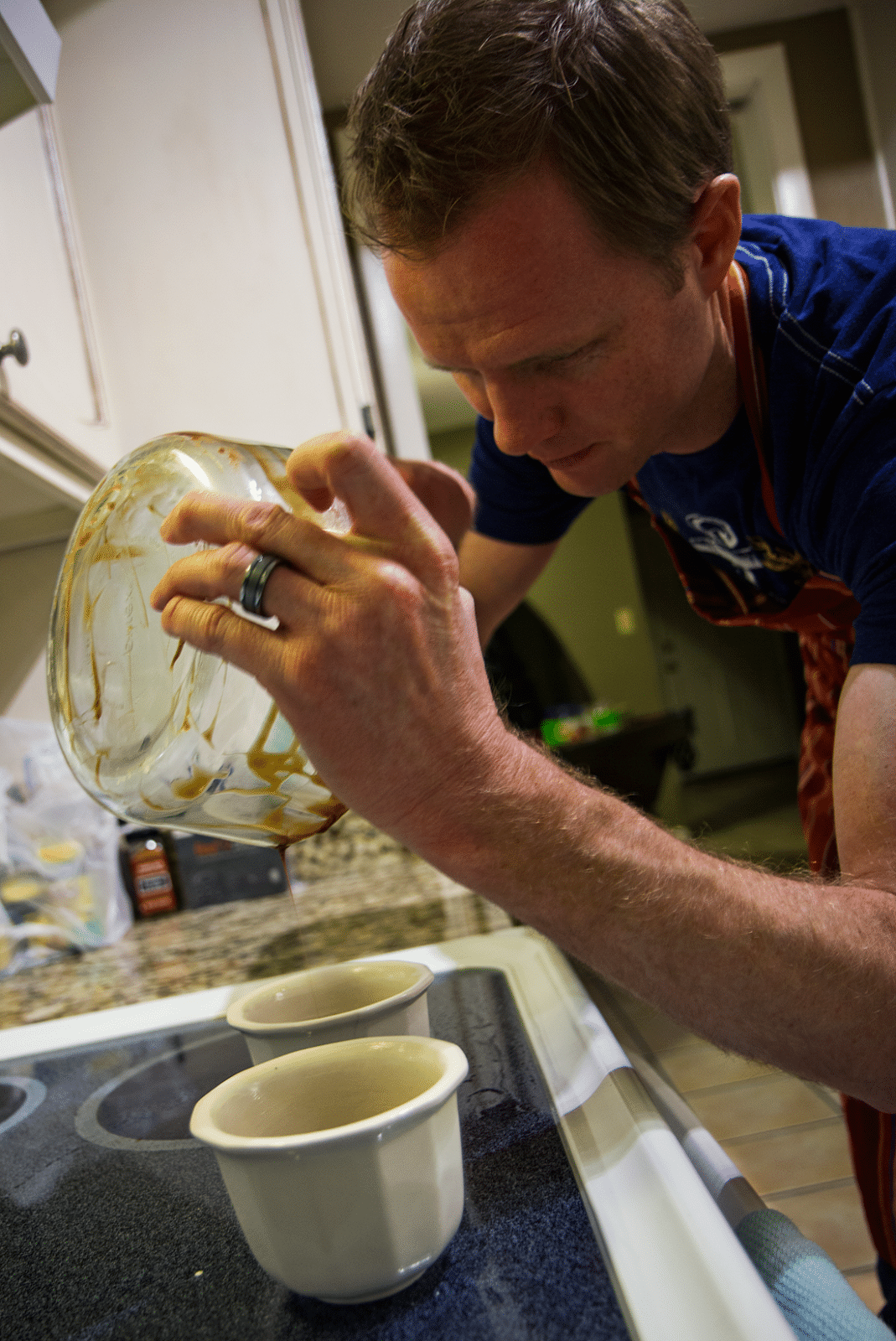 Couple cooking dinner at home together for date night. 