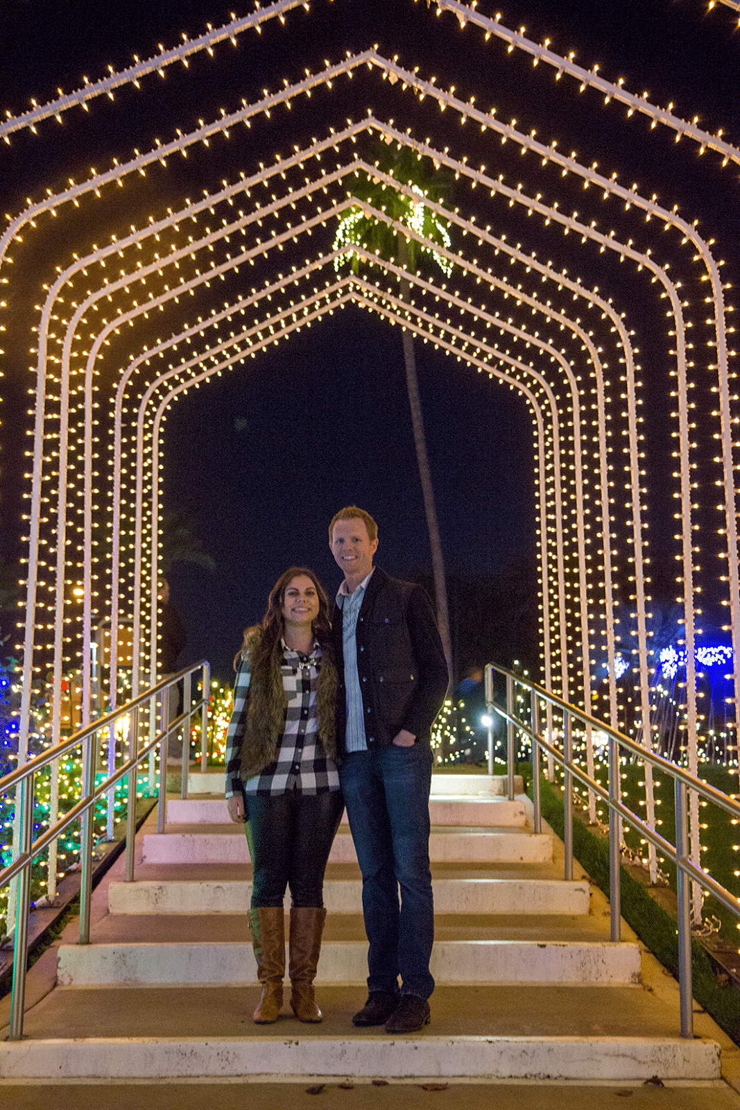 Couple on a date to see Christmas lights. 