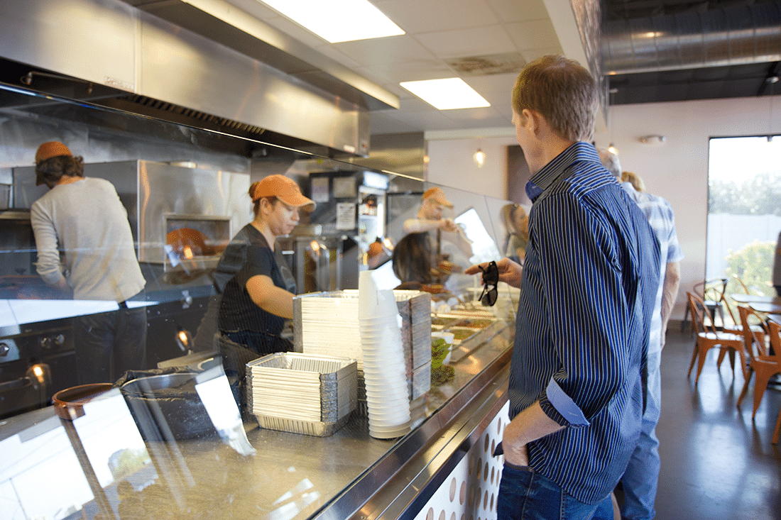 Man ordering enchiladas at Gadzooks. 