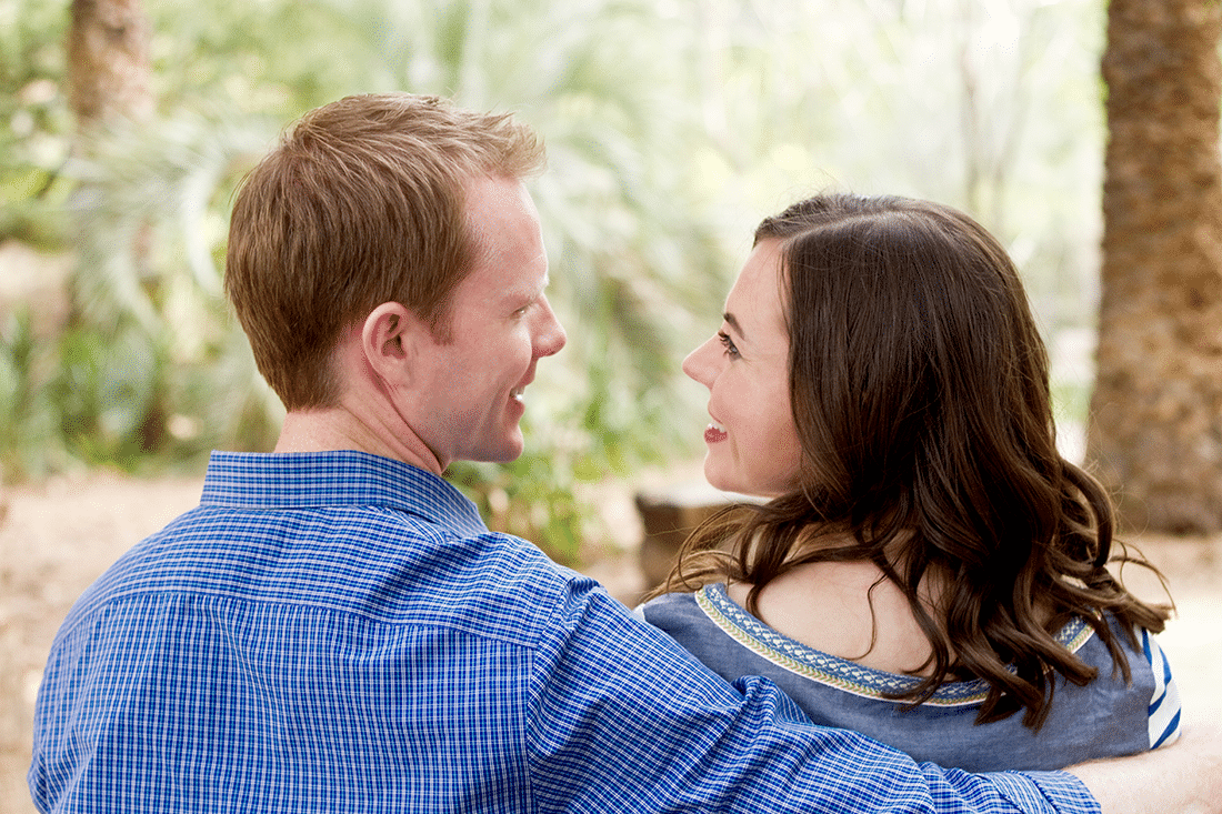 Anniversary #4 pictures with a close up couple picture of a couple looking over their shoulders at one another. 