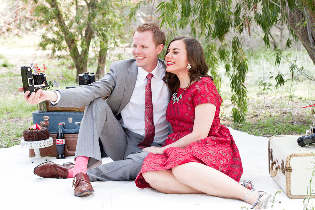 Couple taking a pretend selfie during Anniversary Photo Shoot pictures. 