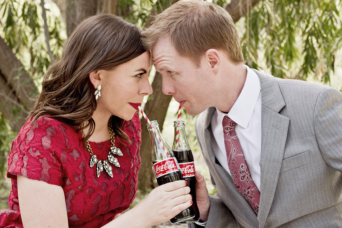 Cute couple pictures with the couple drinking out of vintage coke bottles. 