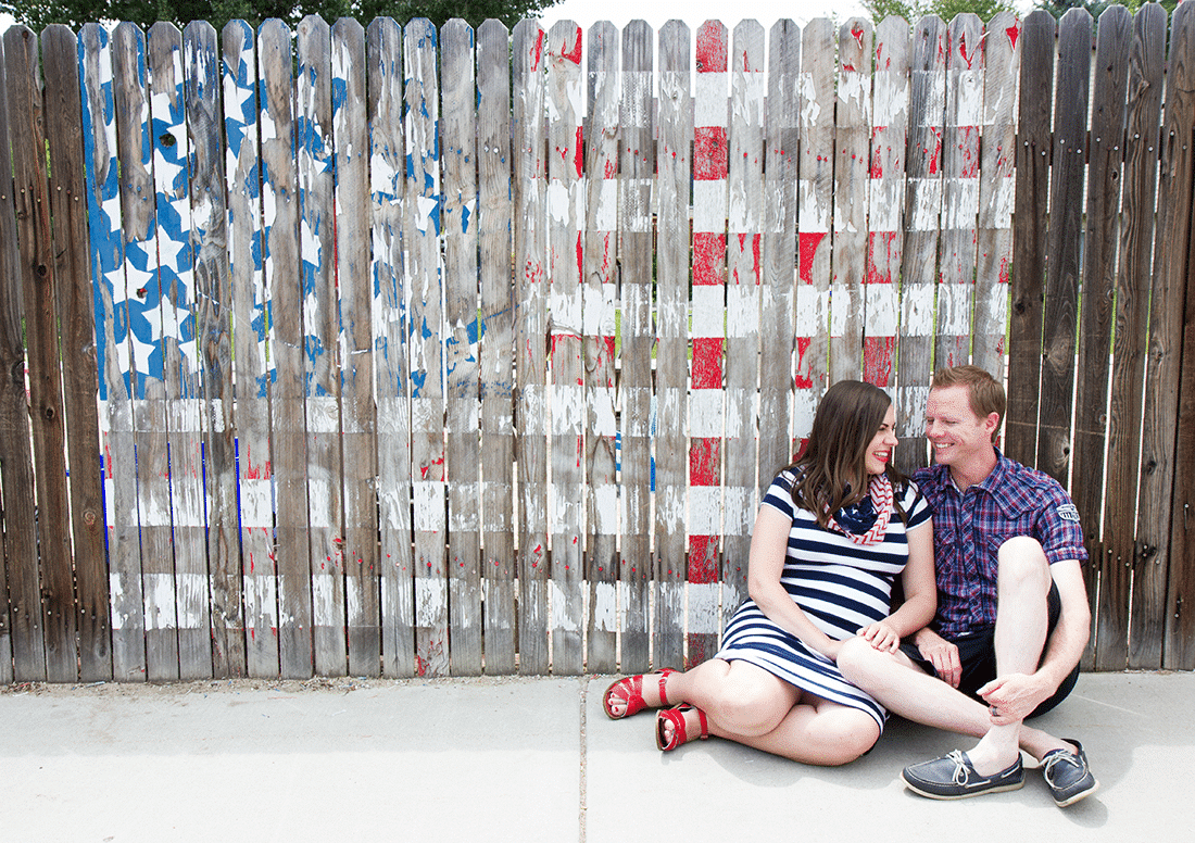 4th of July couple in front of American Flag. 