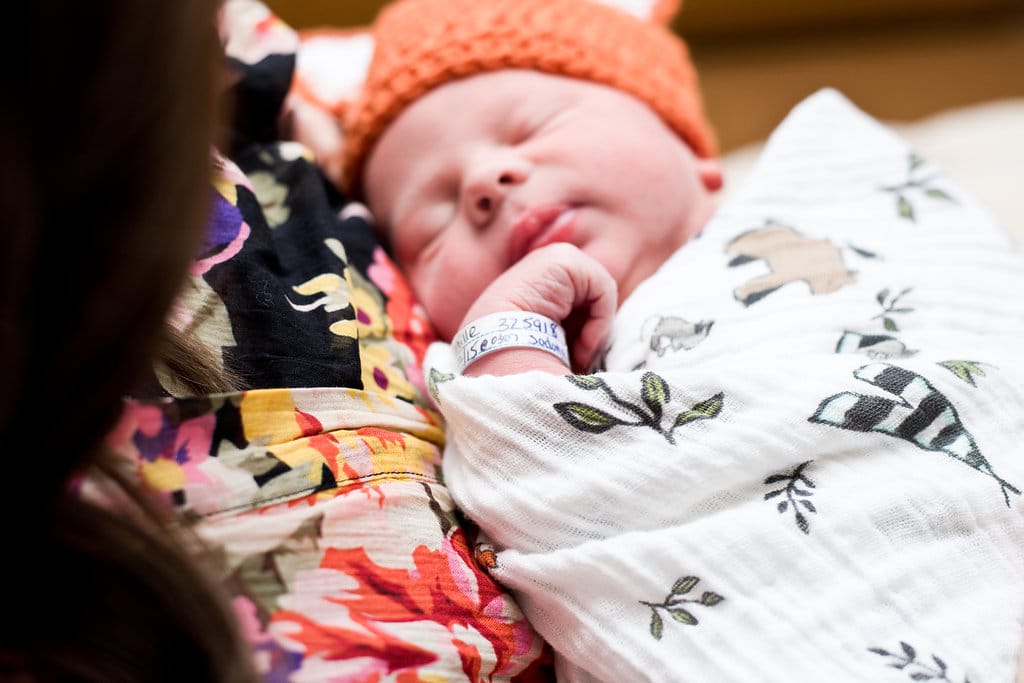 Pictures to capture in the hospital Newborn photography: baby with hospital bracelet close up shot. 