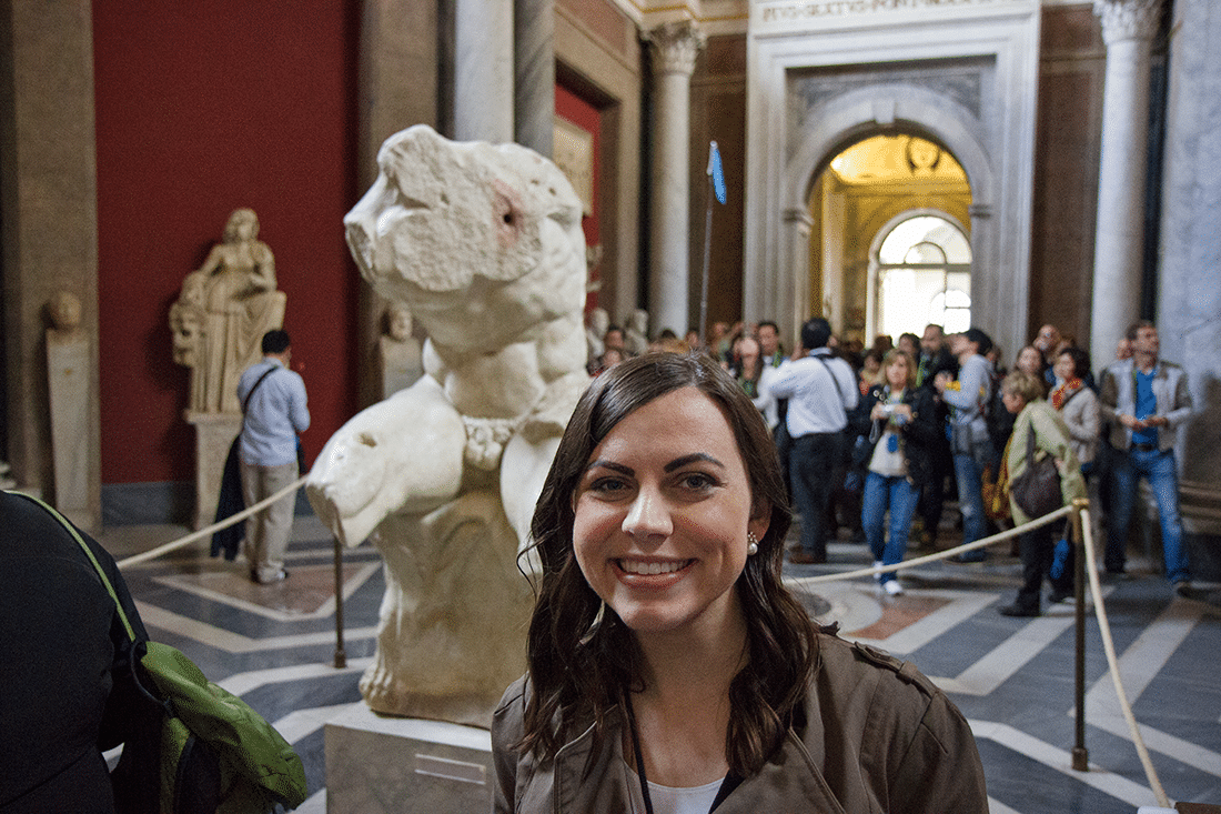 Visiting the Vatican in Rome, Italy. Woman in front of statue Visiting the Vatican in Rome, Italy.