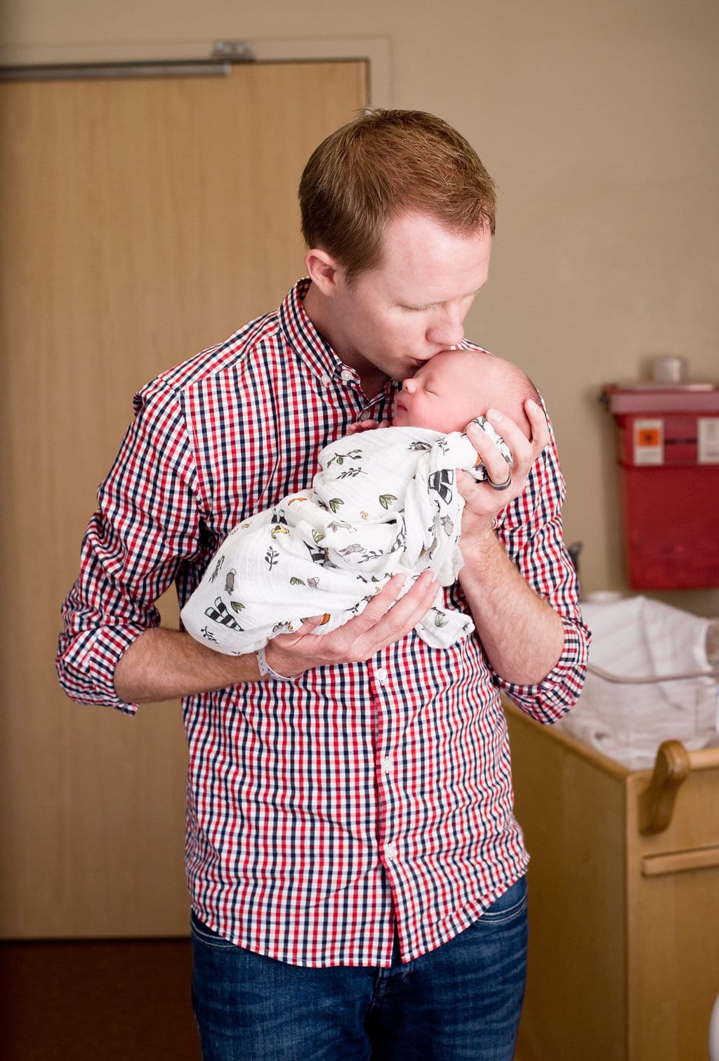 Sweet picture of proud daddy in the hospital hours after birth. 