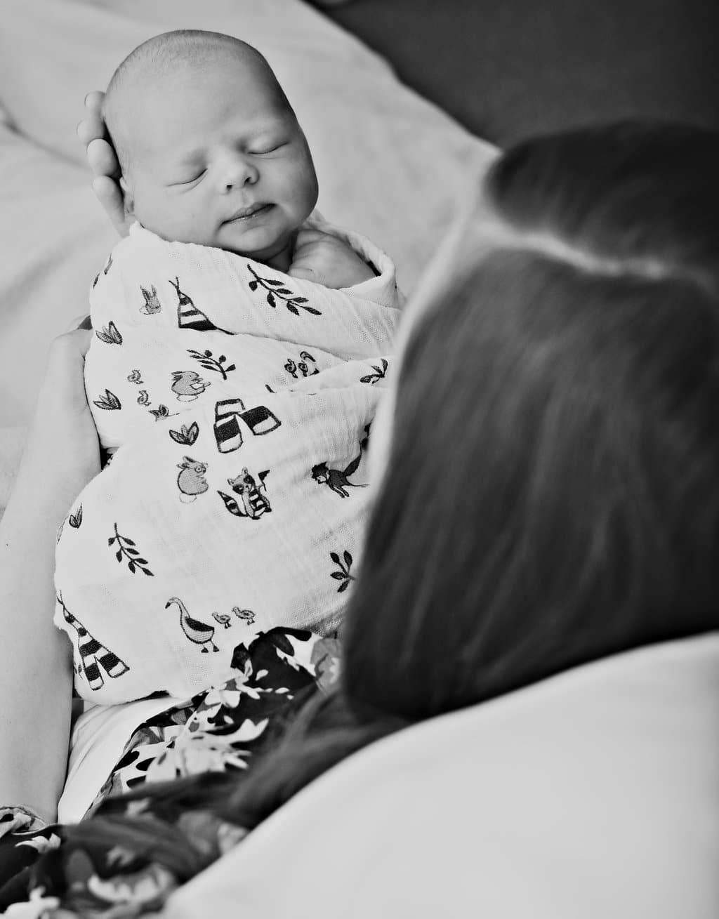 Newborn photography: Hospital photos of mom holding the newborn baby. 