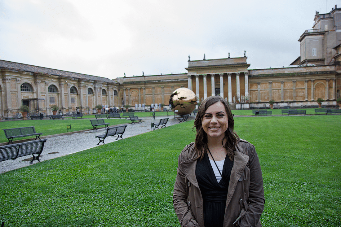 Visiting the Vatican in Rome, Italy, Woman standing in front of the Vatican in Rome, Italy.