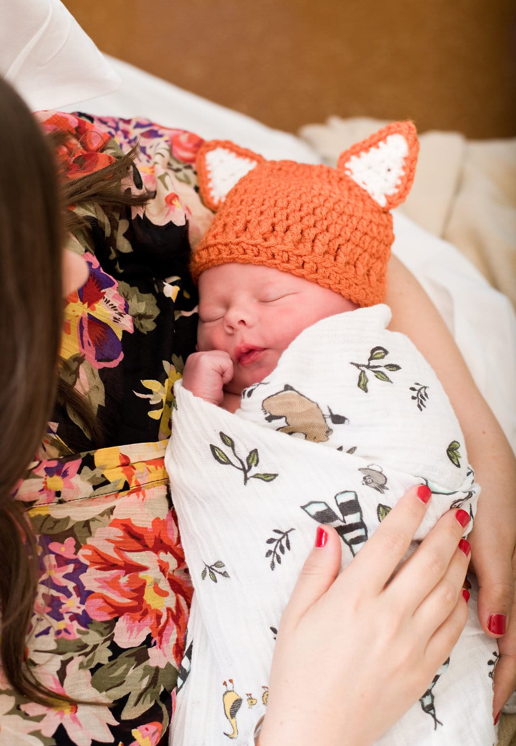 Hospital baby pictures with baby swaddled in a blanket. 