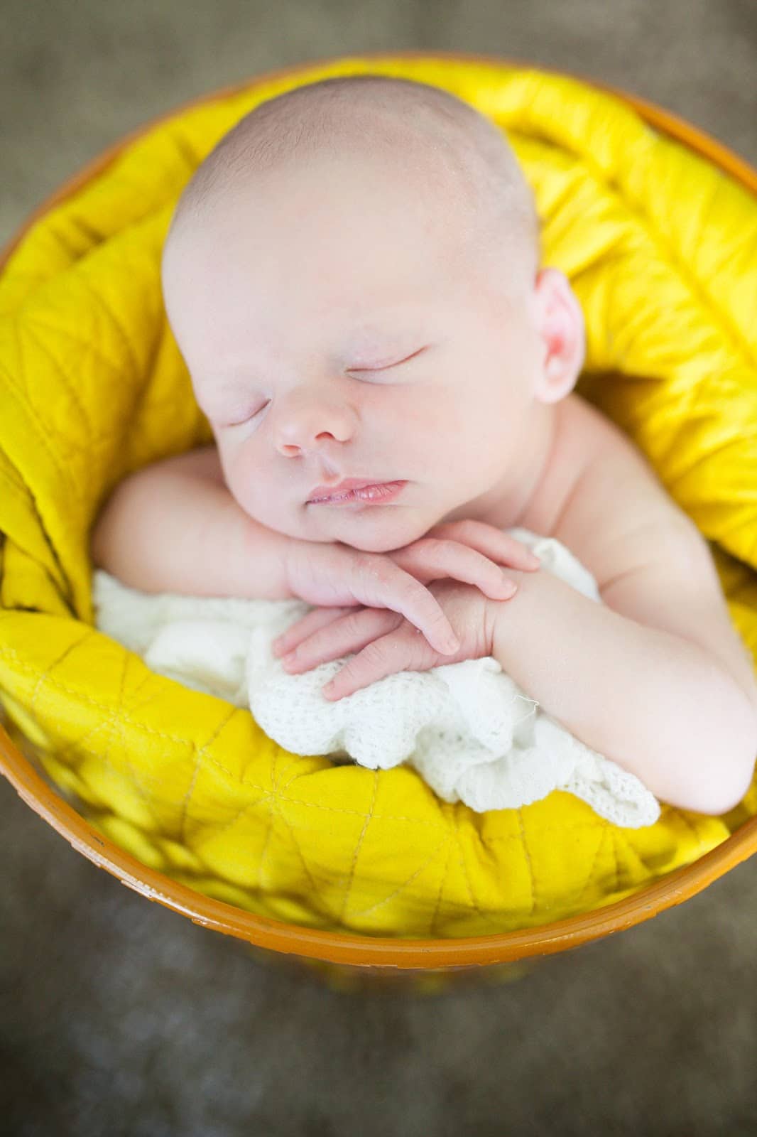 Newborn baby photo shoot ideas: Baby in a basket fast asleep. 