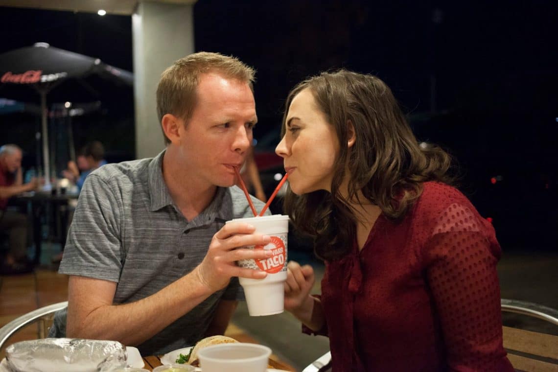 Couple on a date sharing a drink. 