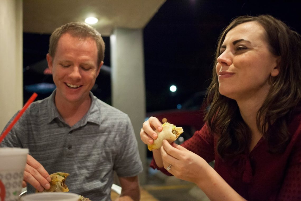 Taco date night with couple laughing at each other. 