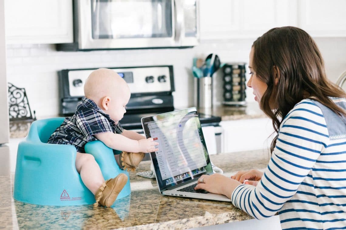 Mom working at home with a baby. 