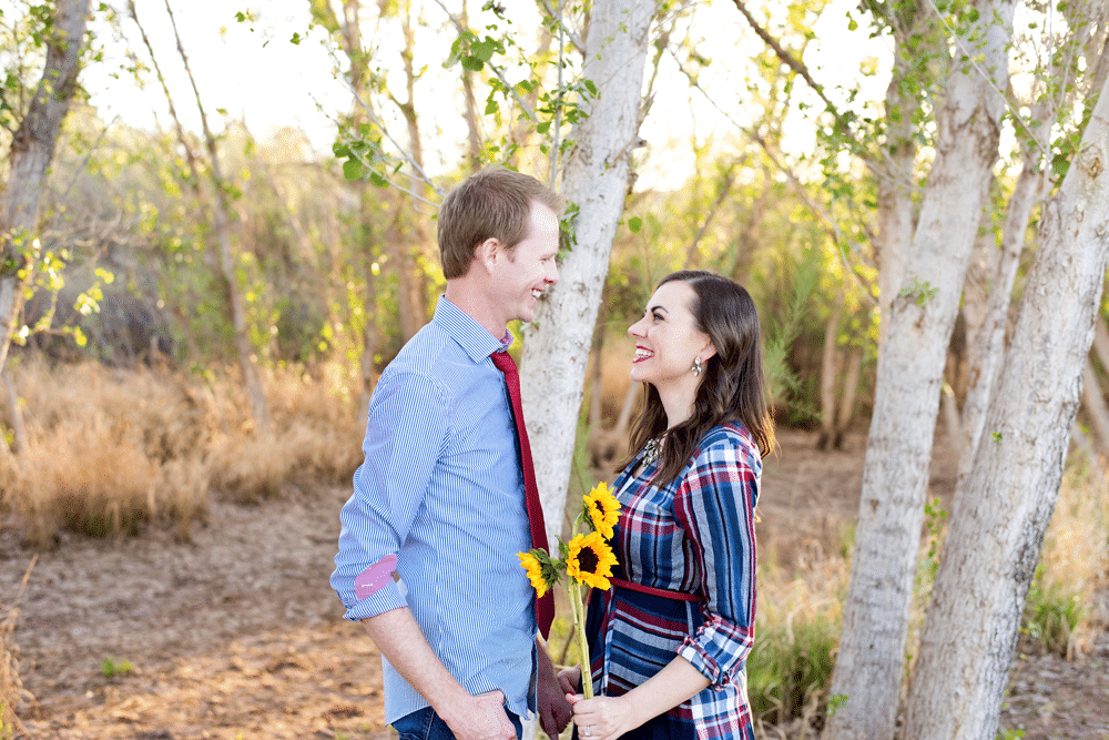 Friday We're in Love: Annual Anniversary Pictures Couple photo shoot with sunflowers.